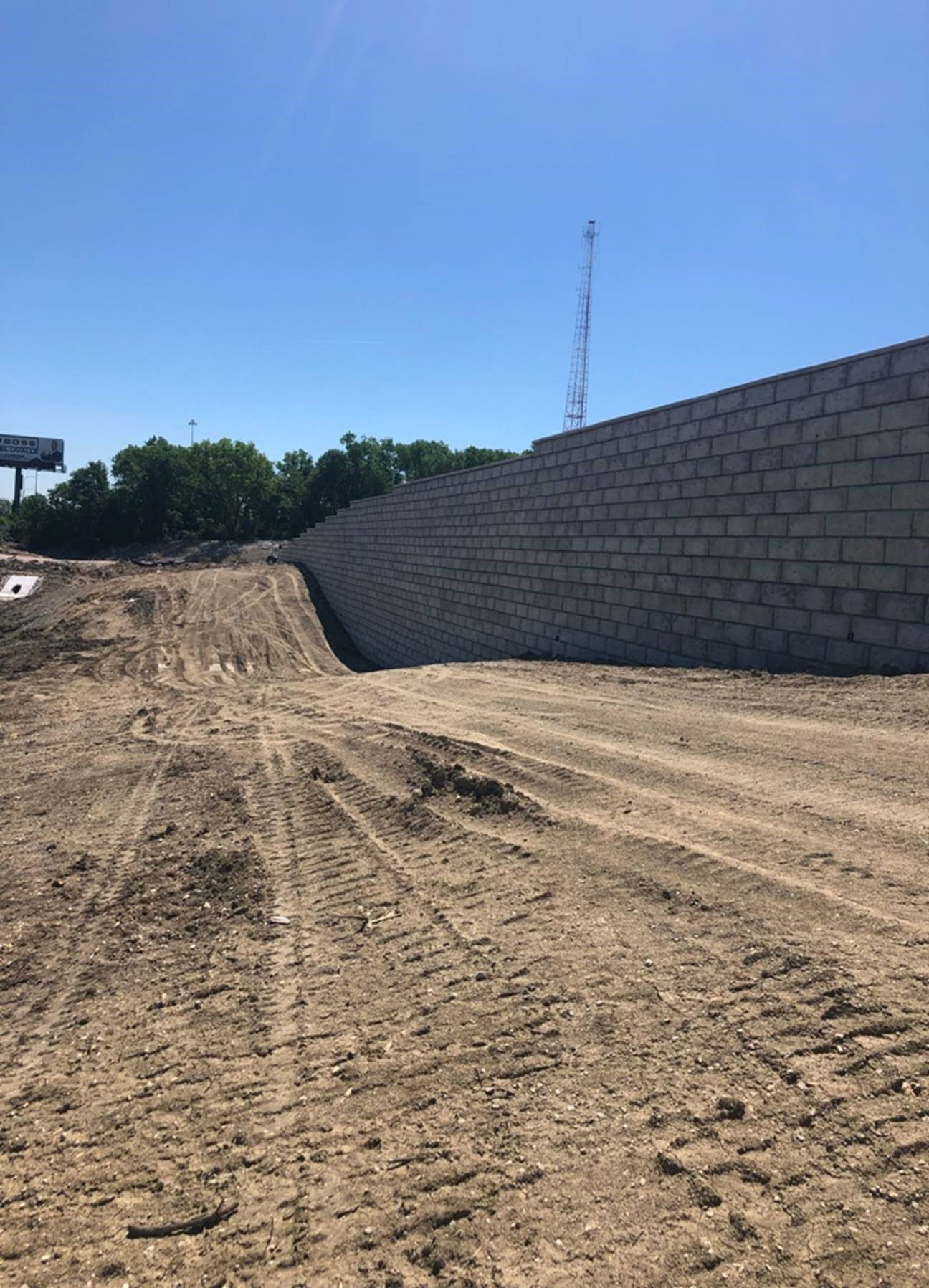An MSE wall against a dirt construction site in Aurora.
