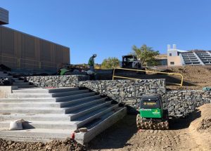 Contractors building a retaining wall in Denver.