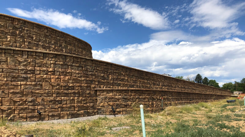 A recently built retaining wall in a dry, arid environment.